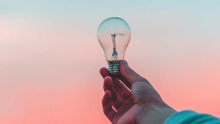 Person holding lightbulb